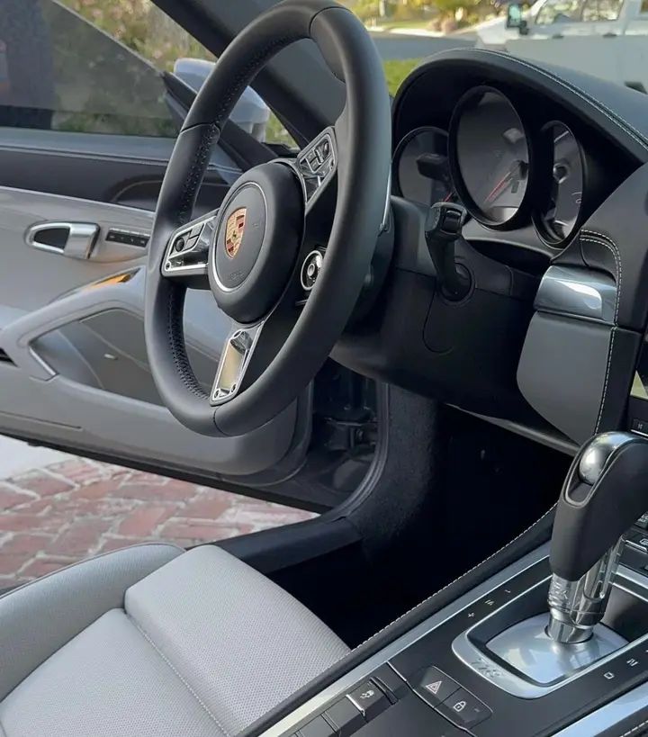 Porsche 718 grey leather interior and steering wheel, spotless after detailing